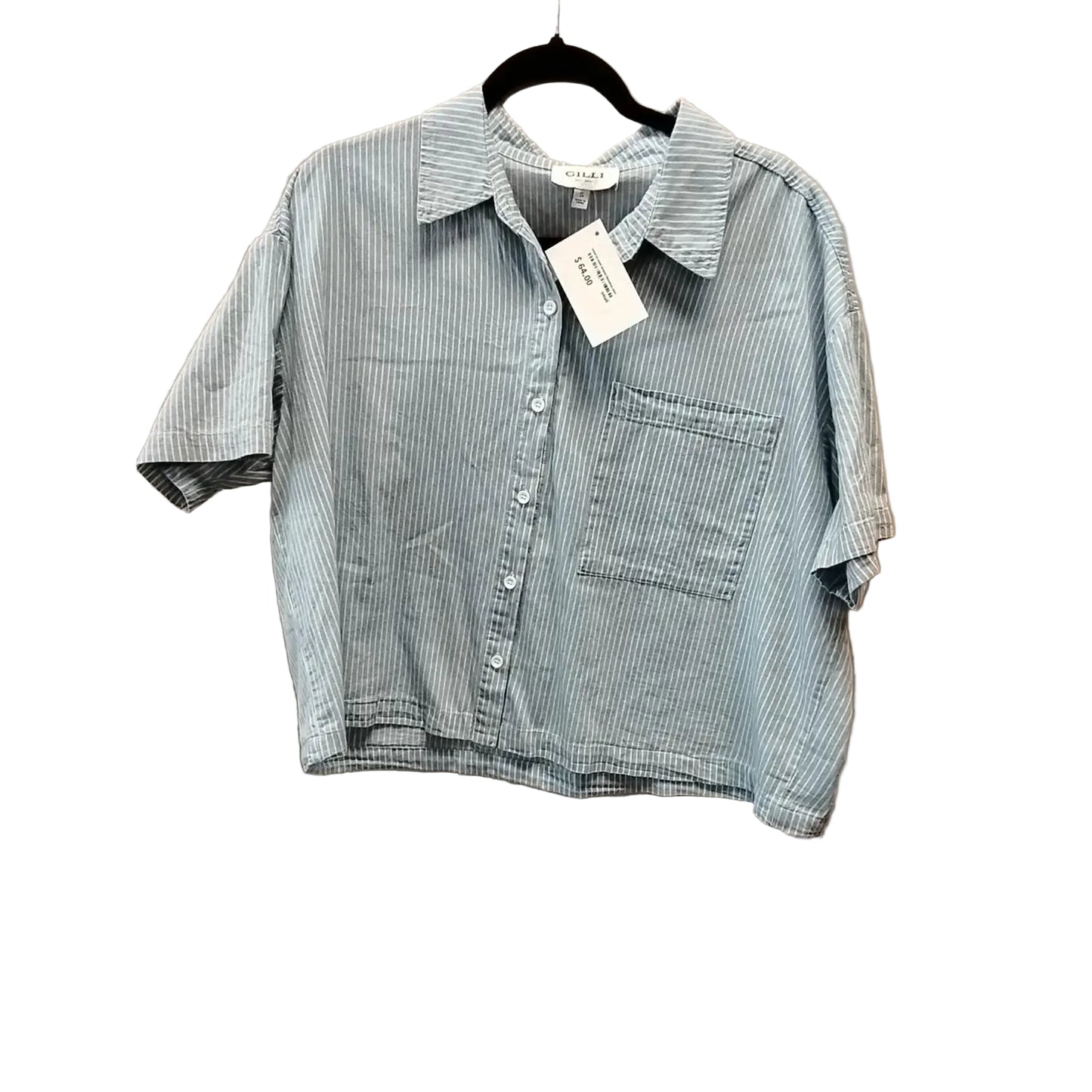 Blue and white striped shirt on a hanger against a beige background