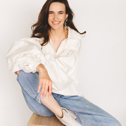 woman in white blouse and jeans